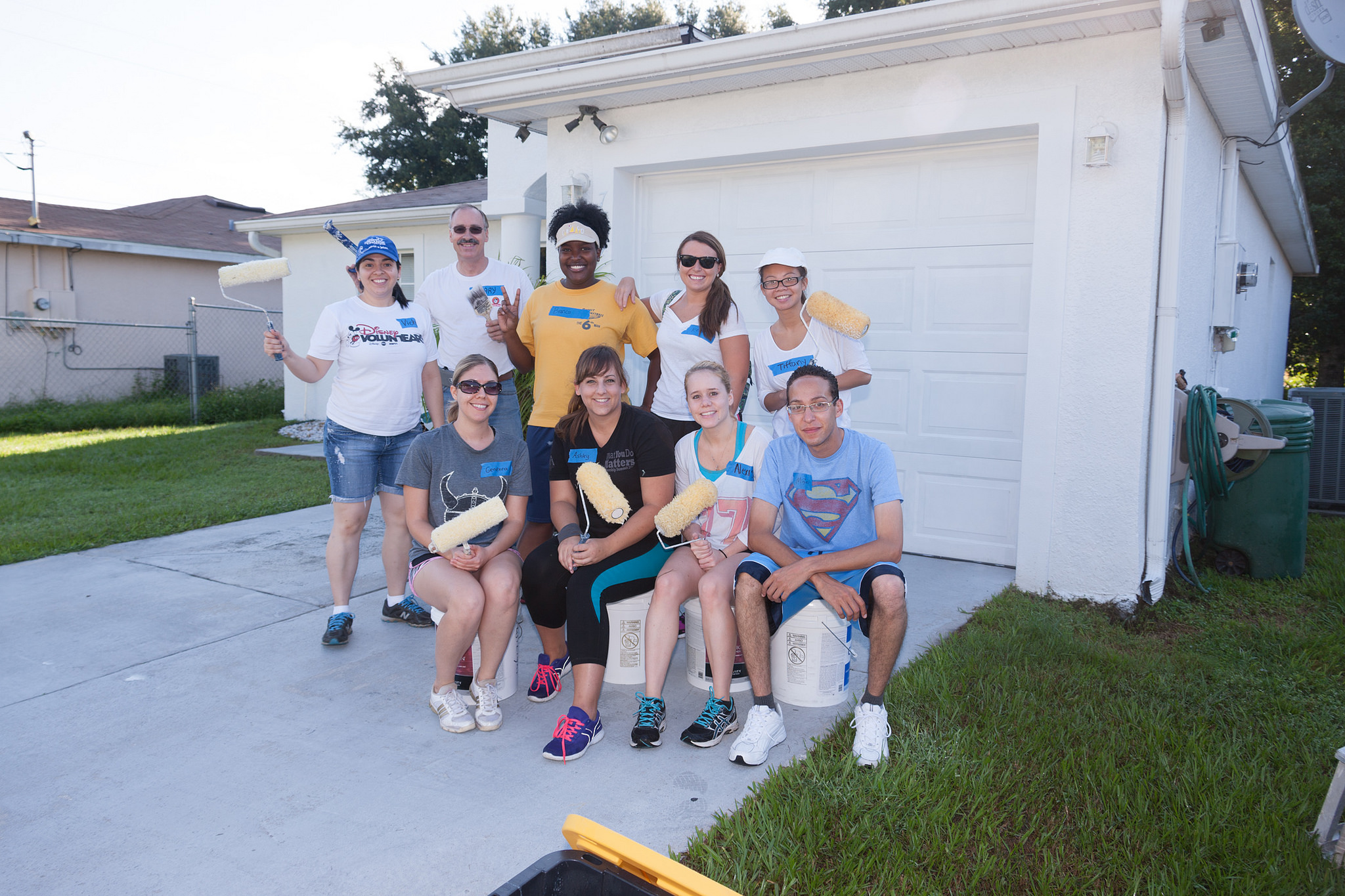 Group of teenagers painting a house