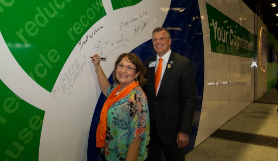 Mayor Jacobs signing a wall for International Plastics Showcase