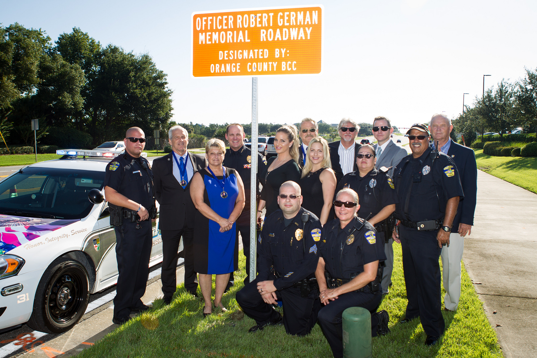 OC personnel at sign unveiling