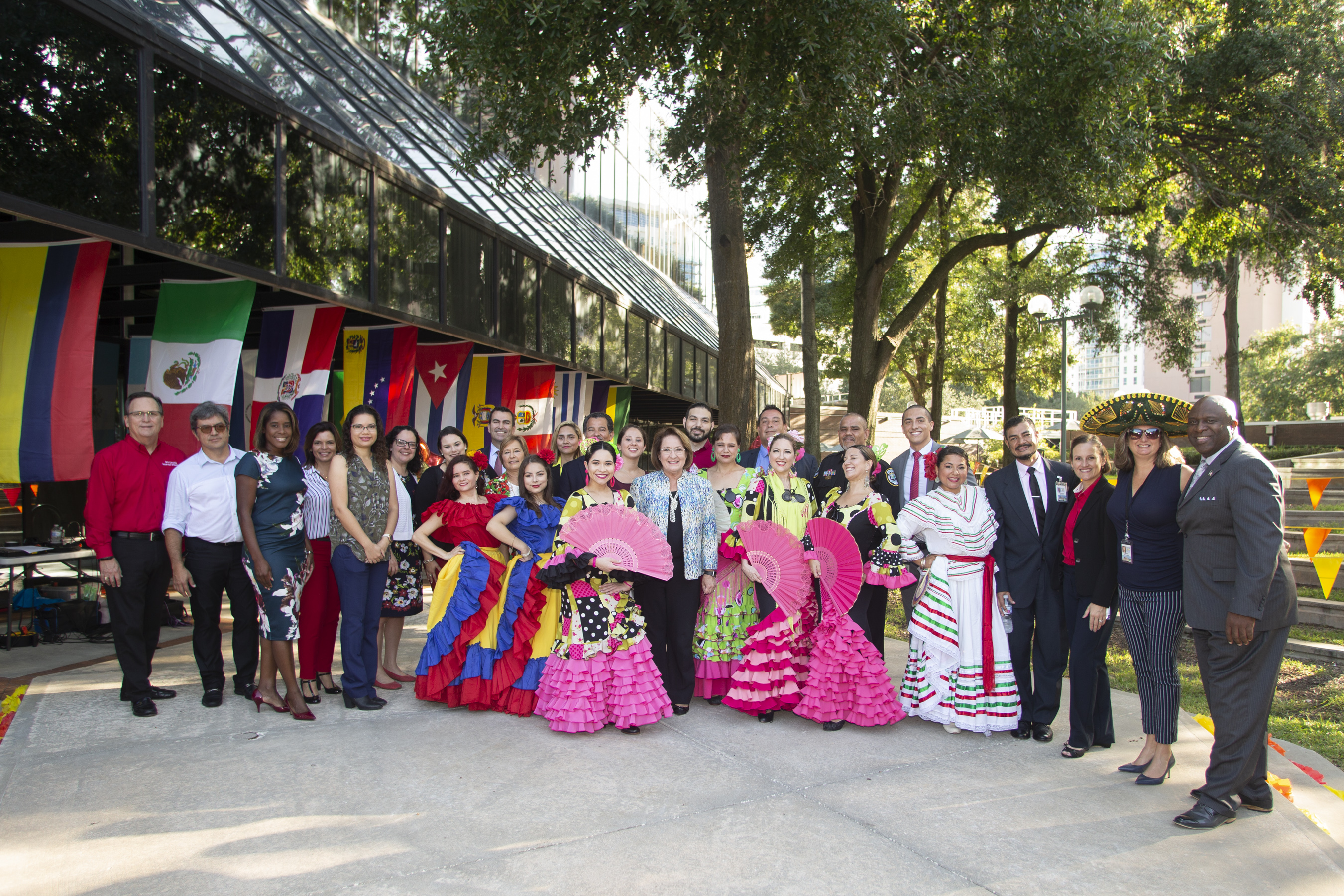 Group photo with county leaders, the hispanic heritage committee, and performers