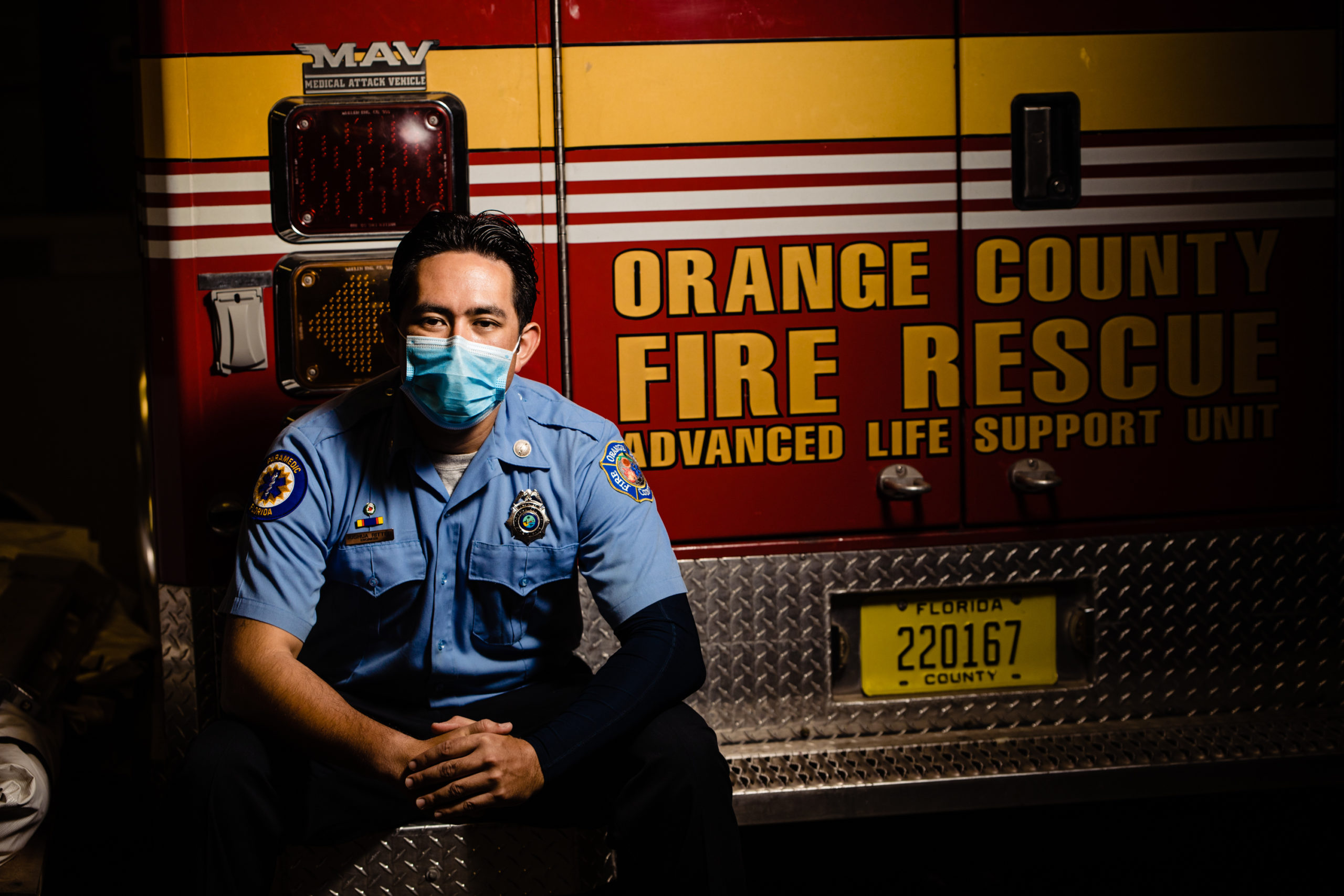 Man sitting next to a fire truck