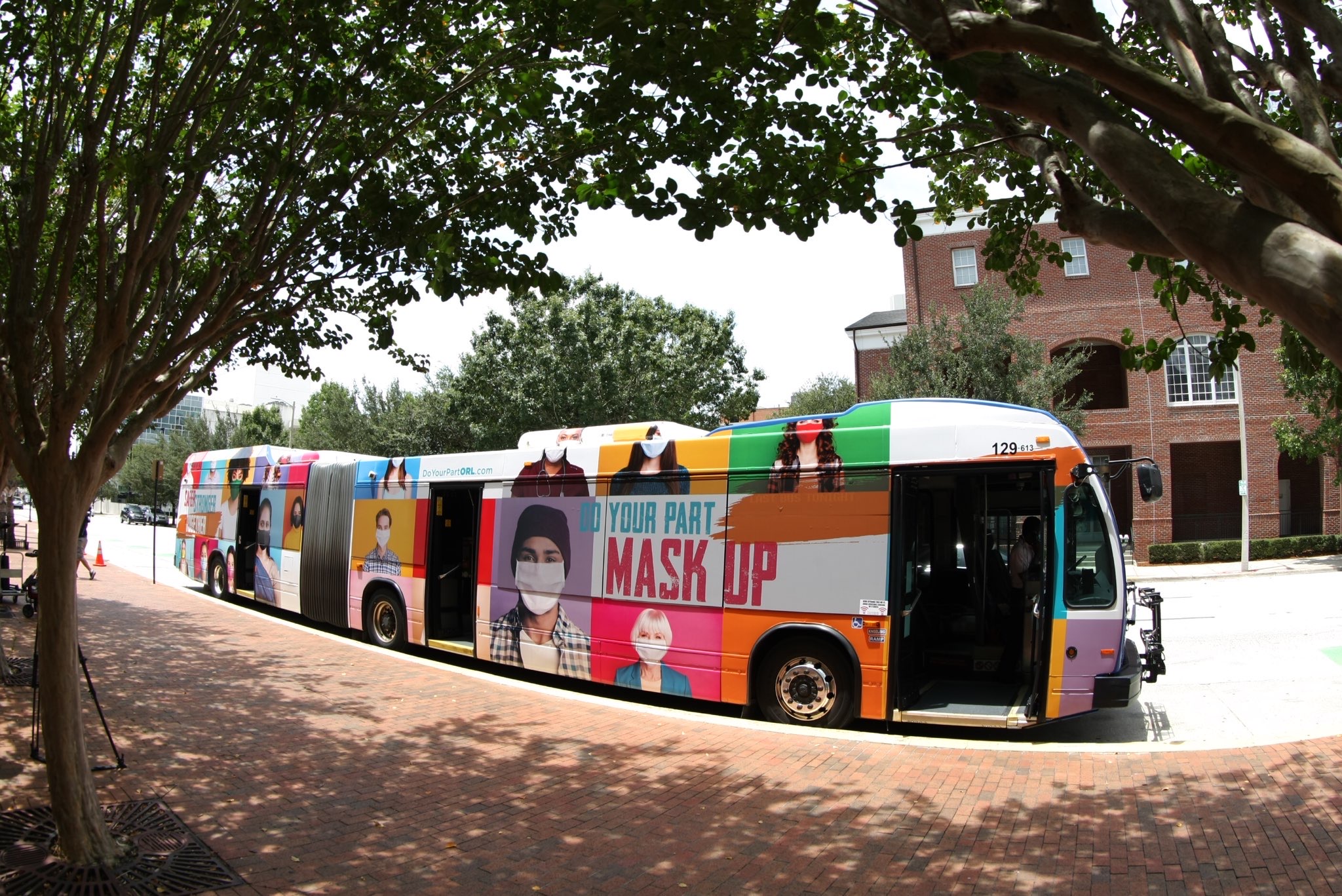 Large LYNX bus wrapped with an advertisement for the Safer, Stronger, Together campaign