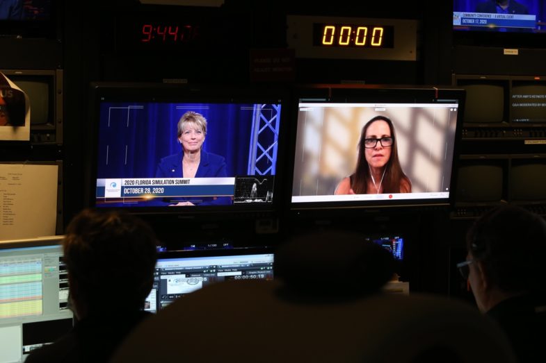 tv screen with two women panelists